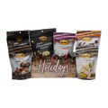 Bedré Fine Chocolate Happy Holidays Garland Gift Box fully styled with Milk and Dark Chocolate Dipped Potato Chips, Melts, Corn Twists, and Pecan Sensations