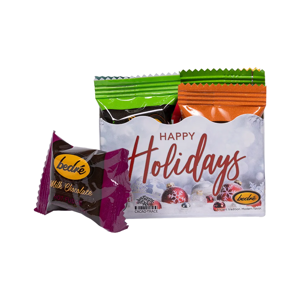 Bedré Fine Chocolate Happy Holidays Mini Gift Box with an individually-wrapped hot fudge meltaway chocolate piece in front