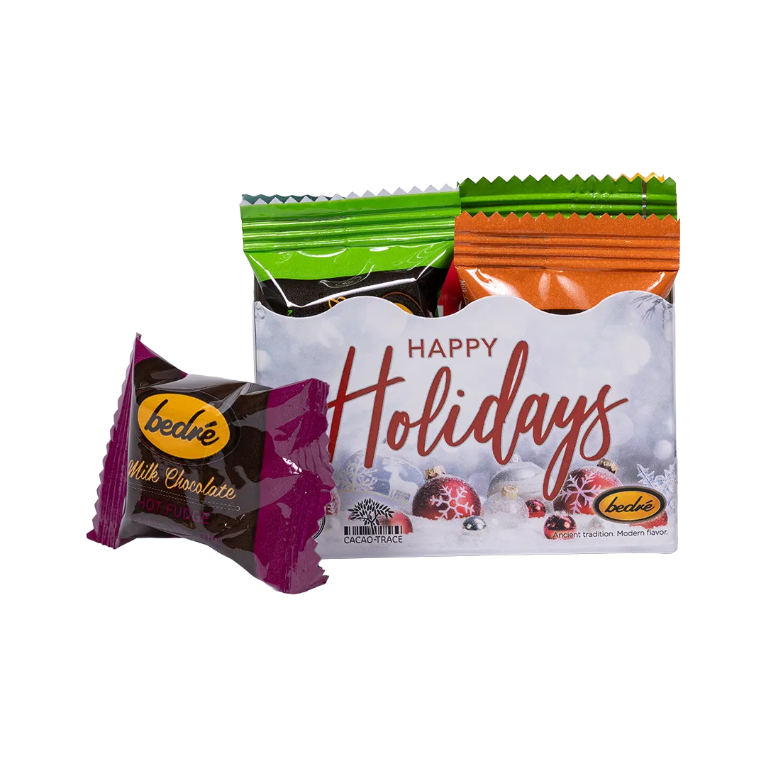 Bedré Fine Chocolate Happy Holidays Mini Gift Box with an individually-wrapped hot fudge meltaway chocolate piece in front