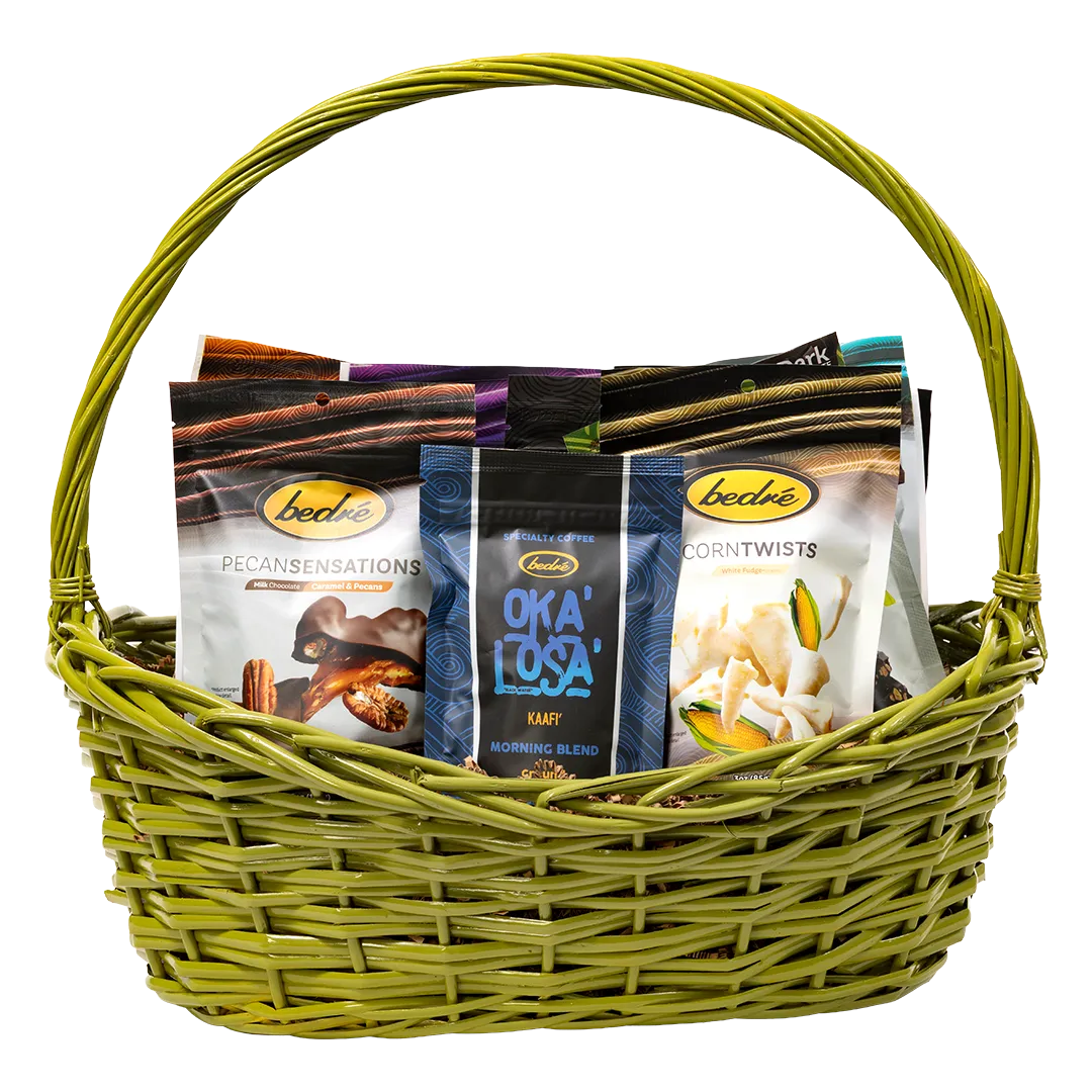 Large jewel-tone green gift basket with pecan sensations, coffee, and corn twists
