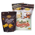 Bedré Fine Chocolate Merry Christmas Gift Box styled with Milk Chocolate Dipped Potato Chips, Corn Twists, and Pecan Sensations