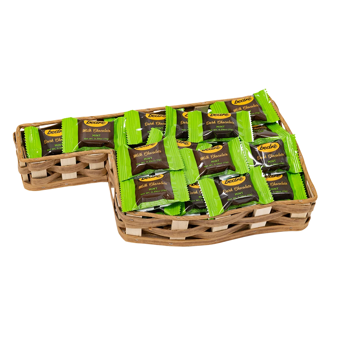 Individually wrapped Bedré milk and dark chocolate mint candies arranged in an Oklahoma-shaped tray