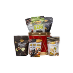 Bedré Fine Chocolate red and gold Christmas Drum tin (large) styled with Milk Chocolate Melts Hot Fudge, Pistachio Cranberry Bark, mini chocolate bars, and Corn Twists pouches