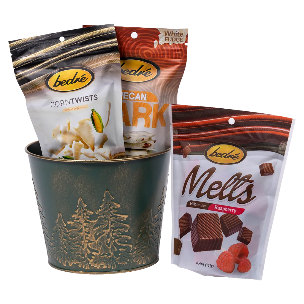 Bedré Fine Chocolate green embossed pine-tree pail (medium) with Corn Twists, Pecan Bark, and Melts Raspberry pouches
