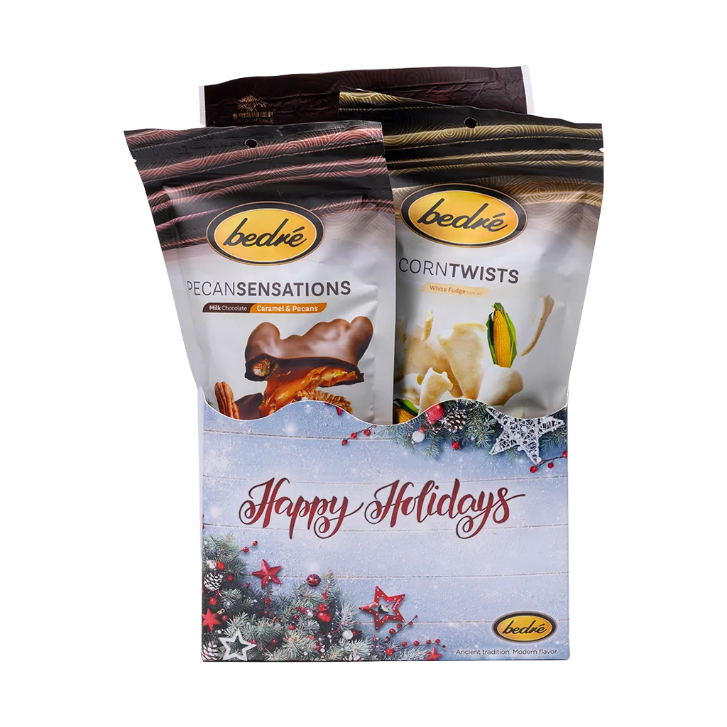 Bedré Fine Chocolate Happy Holidays Tinsel Star Gift Box with red star ornaments, Pecan Sensations and Corn Twists pouches