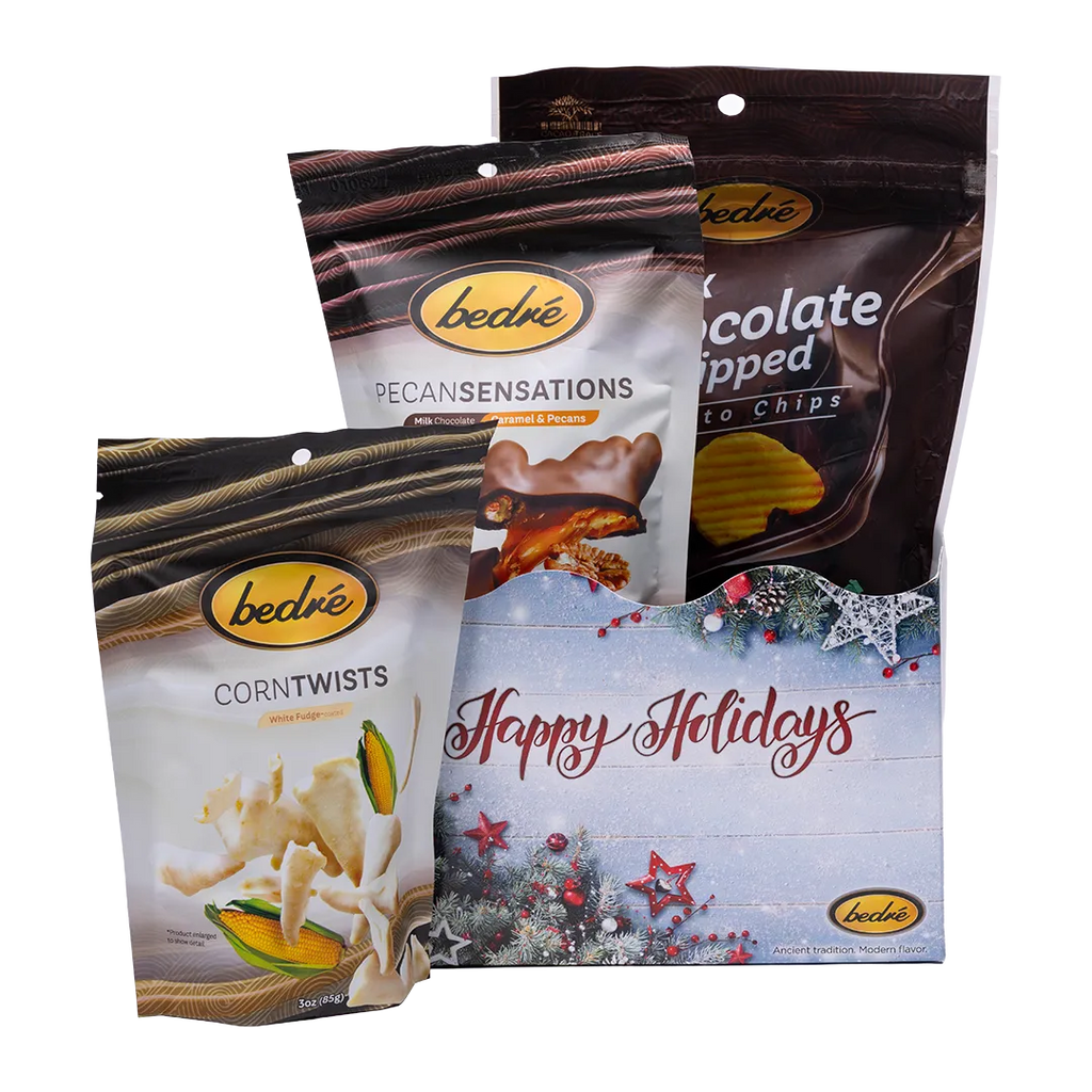 Bedré Fine Chocolate Happy Holidays Tinsel Star Gift Box styled with Milk Chocolate Dipped Potato Chips, Pecan Sensations, and Corn Twists
