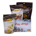 Bedré Fine Chocolate Happy Holidays Tinsel Star Gift Box styled with Milk Chocolate Dipped Potato Chips, Pecan Sensations, and Corn Twists