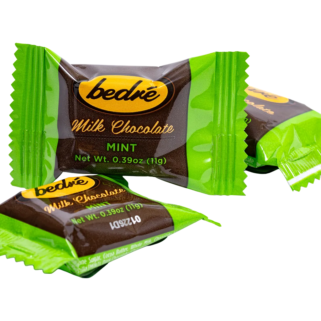 Individually wrapped Bedré Milk Chocolate Mint Melts pieces in green foil