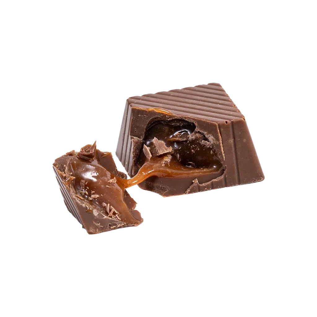 Bedré Milk Chocolate Strawberry Melts piece broken open showing strawberry caramel filling