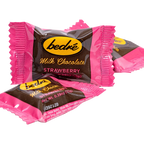 Individually wrapped Bedré Milk Chocolate Strawberry Melts pieces in pink foil