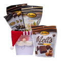 Bedré Fine Chocolate Santa's Favorites Box styled with Milk Chocolate Caramel Melts, Corn Twists, and assorted chocolate bars